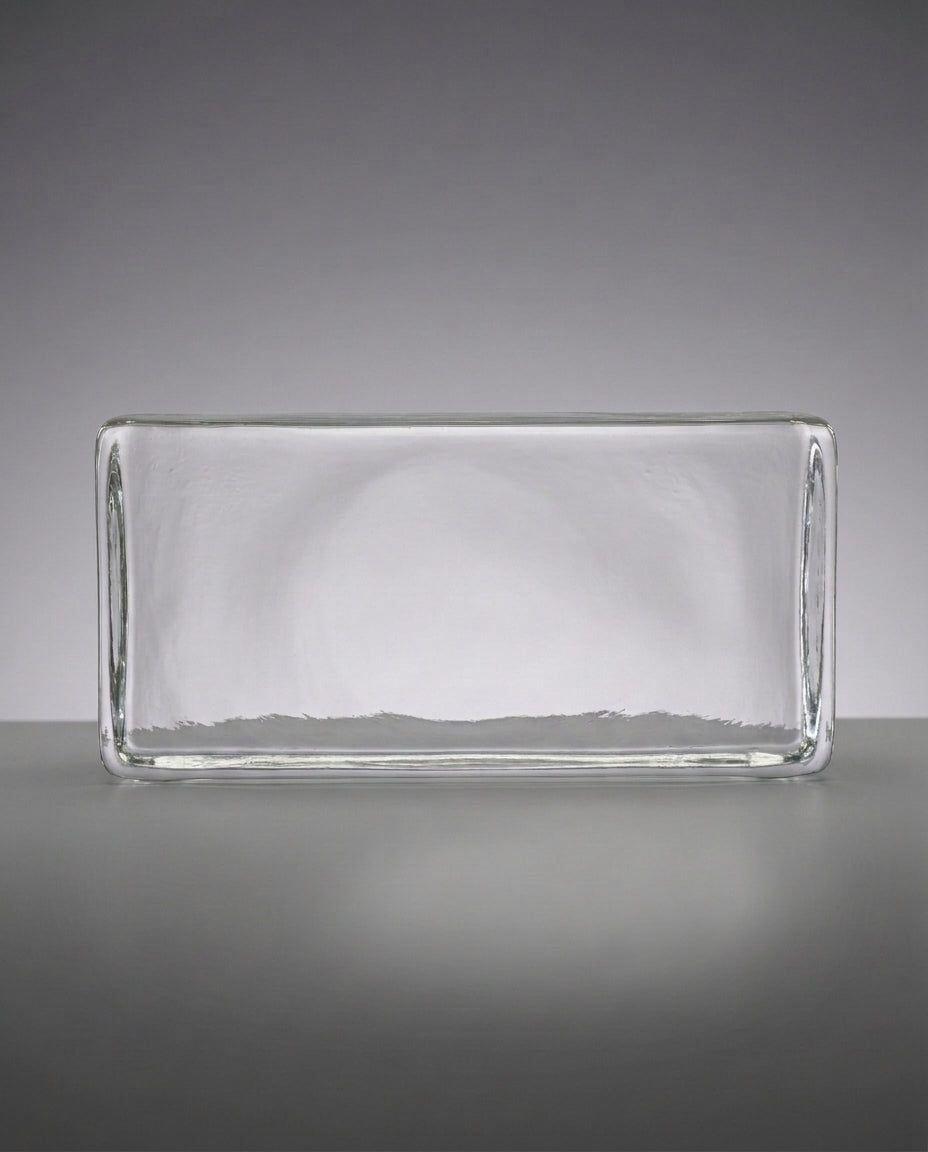 Clear glass rectangular block on a gray background