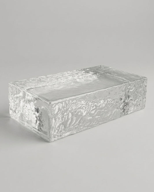 Rectangular glass container with textured surface on a gray background