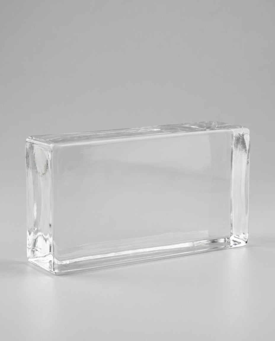 Clear glass block on a gray background