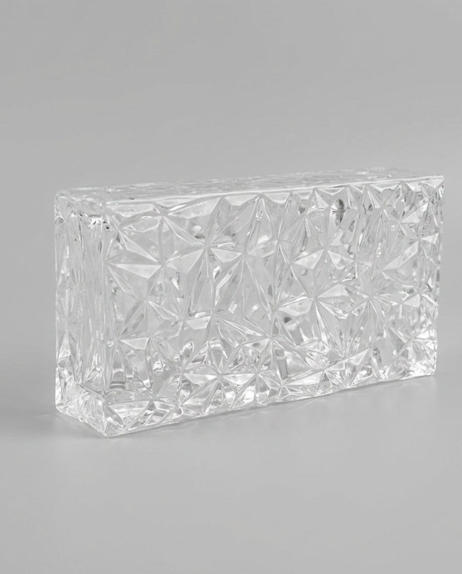 Rectangular crystal block on a gray background
