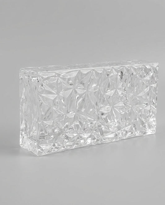 Rectangular crystal block on a gray background