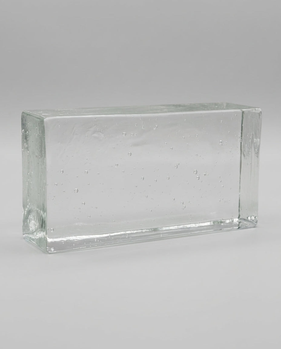 Clear glass block on a gray background