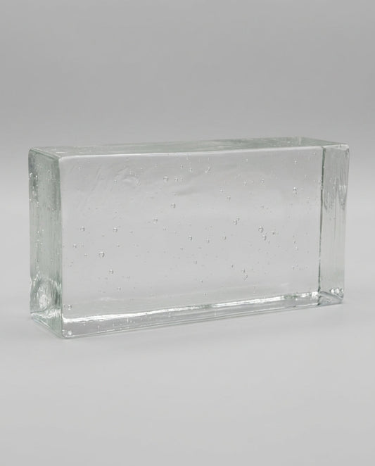 Clear glass block on a gray background