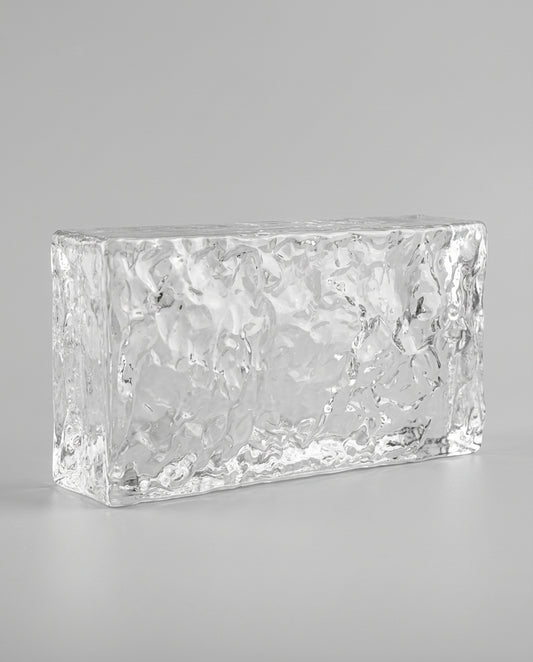 Rectangular crystal block on a gray background
