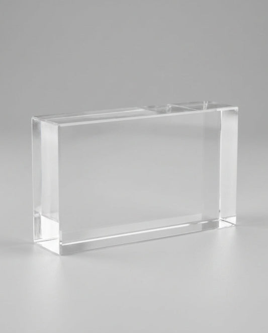 Clear glass block on a gray background