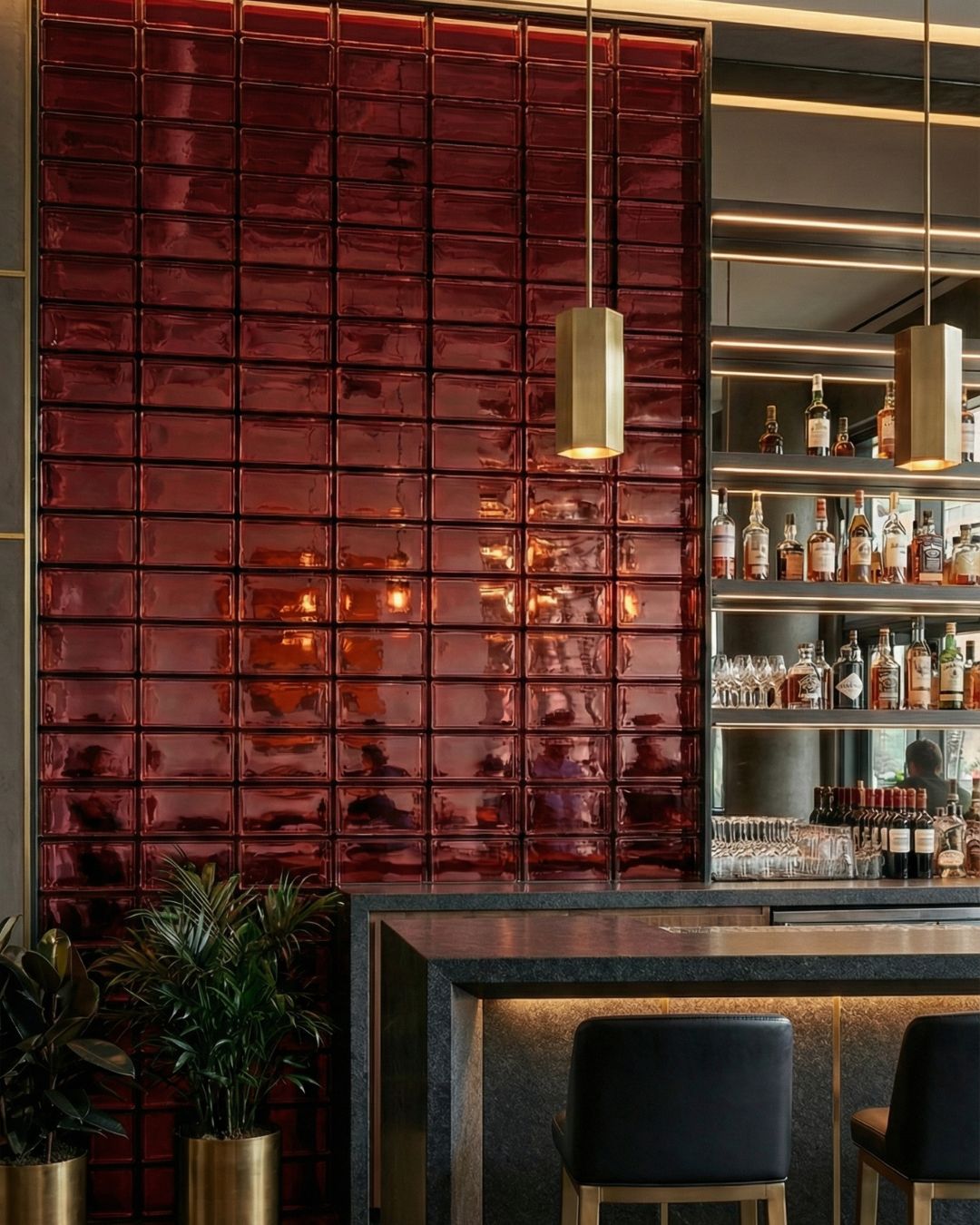 Fashion retail store with woven glass brick feature wall and clothing racks