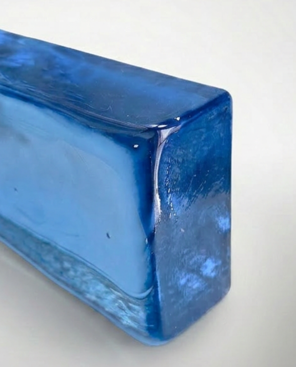 Blue rectangular crystal on a gray background